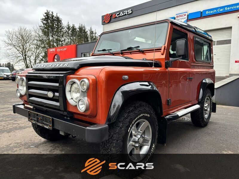 Orange Gebraucht 2009 Land Rover Defender SUV | 43.900 € (Teuer) - Bild 1/4
