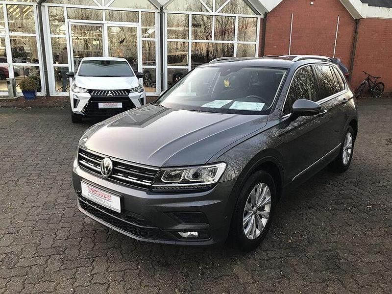 Indiumgrau metallic Gebraucht 2018 VW Tiguan Comfortline SUV | 19.490 € (Guter Preis) - Bild 1/4