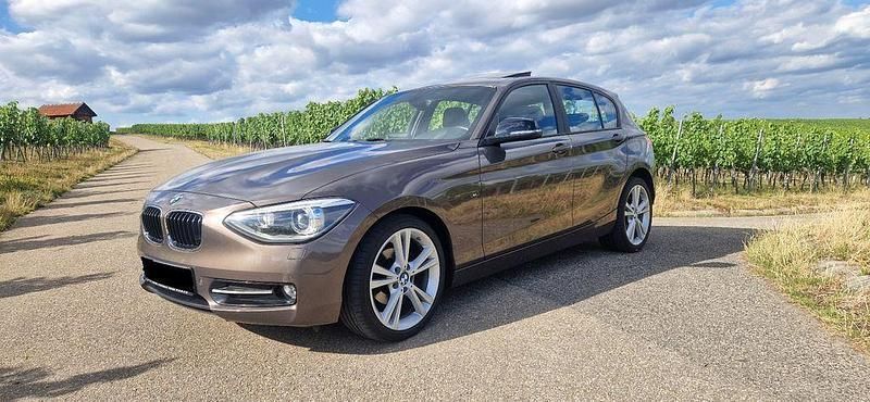Braun Gebraucht 2014 BMW 118 Sport Line Kleinwagen | 12.500 € (Fairer Preis) - Bild 1/4