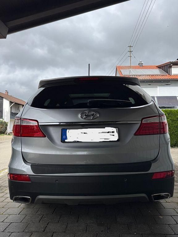 Grau Gebraucht 2014 Hyundai Grand Santa Fe Premium SUV | 15.000 € (Fairer Preis) - Bild 1/4