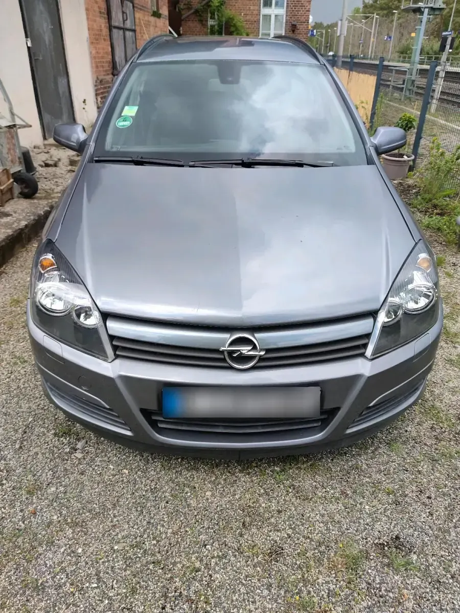 Używany Opel Astra 75 KM (55 kW) 2004 Purpurowy Kombi