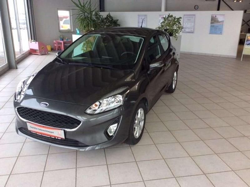 Grau (metallic) Gebraucht 2018 Ford Fiesta Trend Kleinwagen | 12.980 € - Bild 1/4
