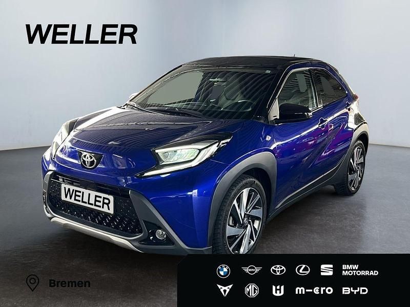 Juniper blue (8y8)/ black mica Neu 2025 Toyota Aygo X X-plore SUV | 22.990 € (Etwas zu teuer) - Bild 1/3
