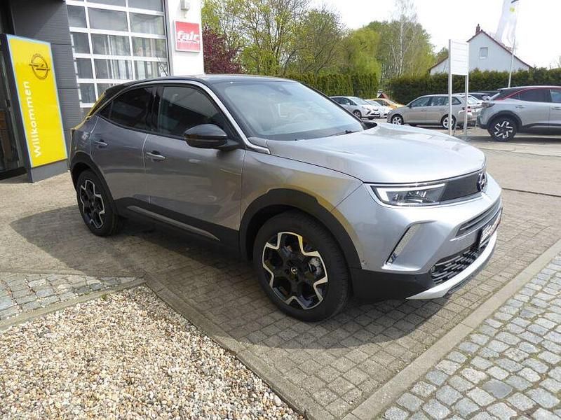 Gebraucht Opel Mokka-e Ultimate 100 kW (136 PS) 2023 Kontrast grau metallic SUV
