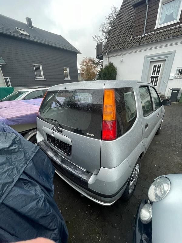 Silber Gebraucht 2004 Subaru Justy Kleinwagen | 1.500 € - Bild 1/4