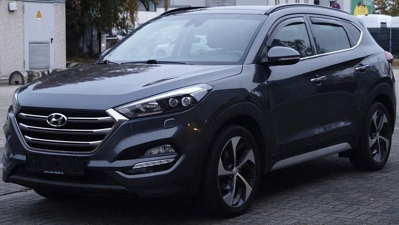 Grau Gebraucht 2018 Hyundai Tucson Premium SUV | 19.980 € (Fairer Preis) - Bild 1/4