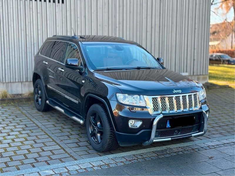 Braun Gebraucht 2013 Jeep Grand Cherokee Overland SUV | 9.900 € (Fairer Preis) - Bild 1/4