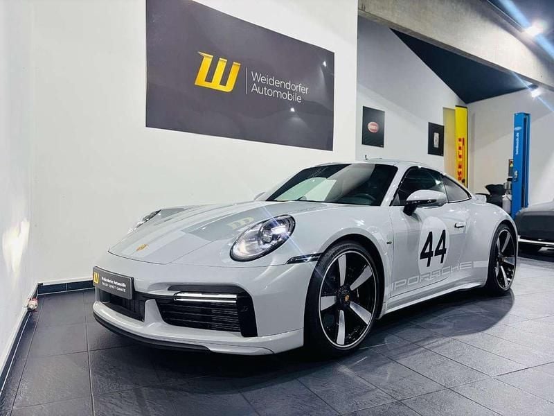 P9p9 sportgraumetallic Gebraucht 2023 Porsche 992 Sport Coupé | 999.999 € - Bild 1/4