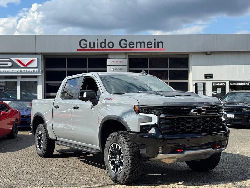 Slate grey Neu 2024 Chevrolet Silverado SUV | 88.800 € (Teuer) - Bild 1/4