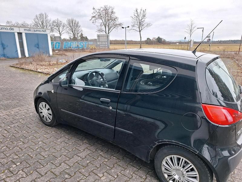 Second-hand Mitsubishi Colt 70 CP (51 kW) 2006 Negru Berlinǎ