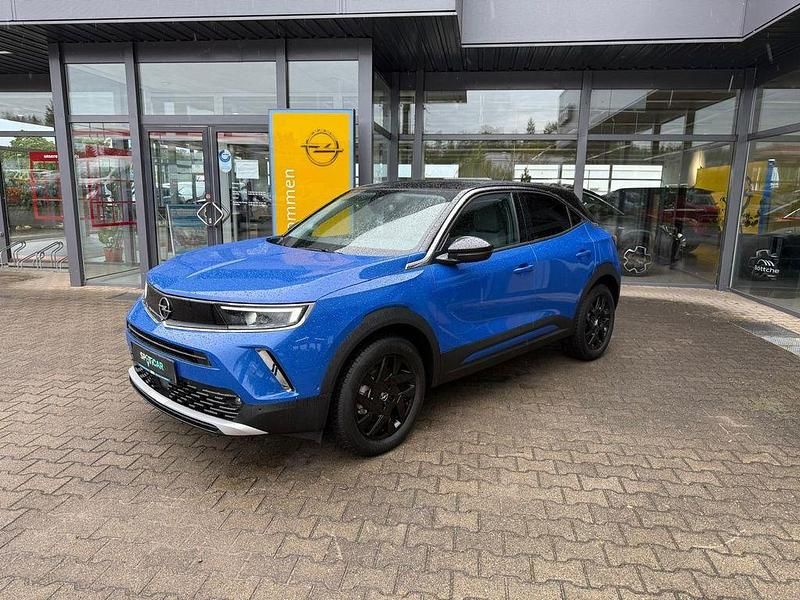 Gebraucht Opel Mokka-e Elegance 100 kW (136 PS) 2023 Kontrast grau/quarz silber SUV