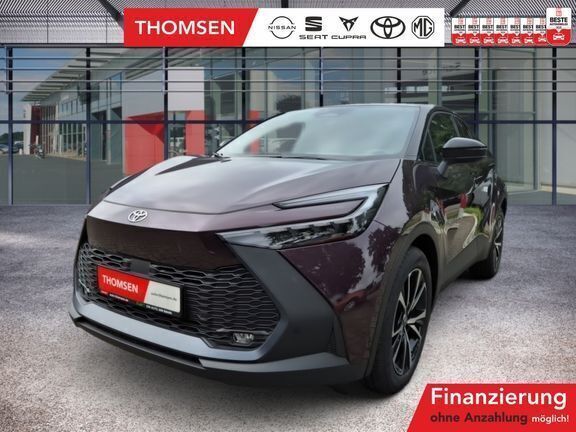 Dunkel amethyst metallic/ dach schwarz Gebraucht 2024 Toyota C-HR Team SUV | 33.485 € (Teuer) - Bild 1/4