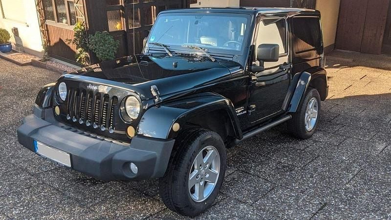 Schwarz Gebraucht 2013 Jeep Wrangler Sahara SUV | 38.400 € - Bild 1/4