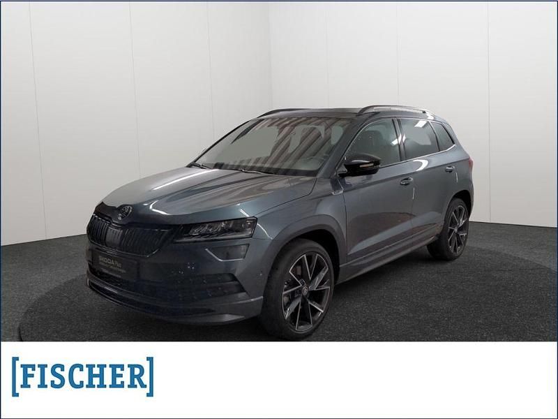 Grau Gebraucht 2021 Skoda Karoq SportLine SUV | 31.970 € (Fairer Preis) - Bild 1/4