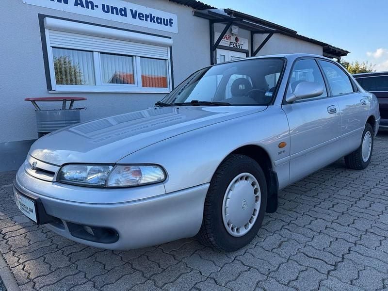 Grau Gebraucht 1993 Mazda 626 Limousine | 2.499 € - Bild 1/4