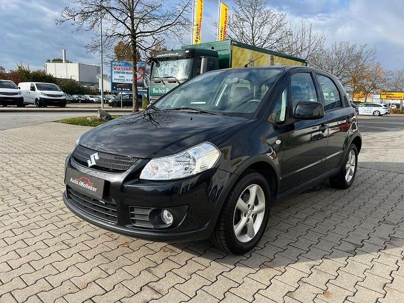 Schwarz Gebraucht 2009 Suzuki SX4 Limousine | 5.690 € (Fairer Preis) - Bild 1/4