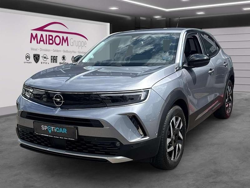 Gebraucht Opel Mokka-e Elegance 100 kW (136 PS) 2021 Kontrast grau/quarz silber SUV