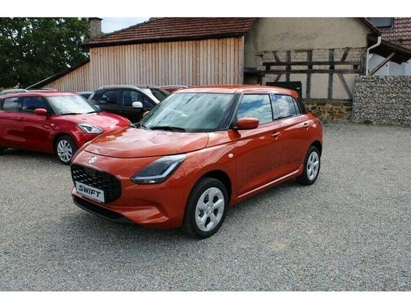 Orange Neu 2024 Suzuki Swift Comfort Kleinwagen | 19.999 € - Bild 1/4