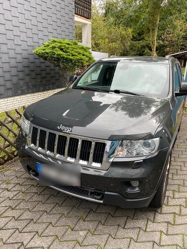 Grau Gebraucht 2011 Jeep Grand Cherokee SUV | 9.950 € (Teuer) - Bild 1/4