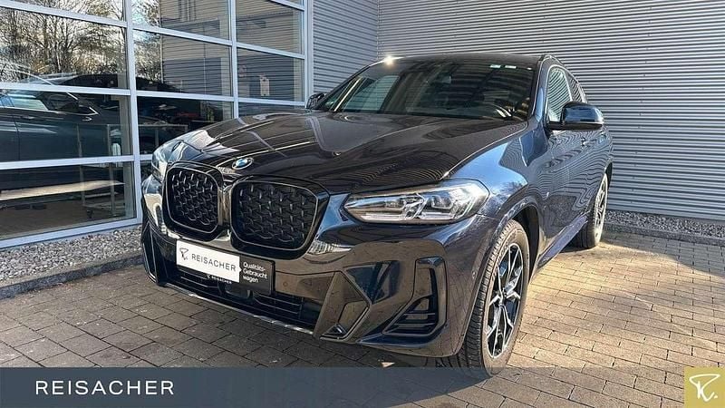 Carbonschwarz metallic Gebraucht 2024 BMW X4 Efficient Dynamics SUV | 54.949 € (Superpreis) - Bild 1/4