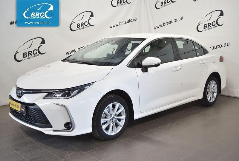 Weiß Gebraucht 2023 Toyota Corolla Hybrid Limousine | 22.501 € (Fairer Preis) - Bild 1/4