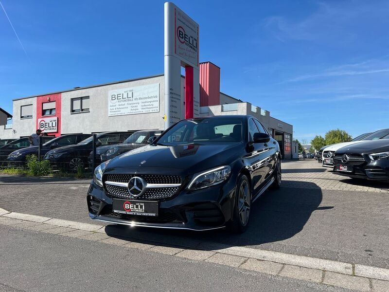 Schwarz Gebraucht 2021 Mercedes C300e AMG line Limousine | 29.950 € (Fairer Preis) - Bild 1/4