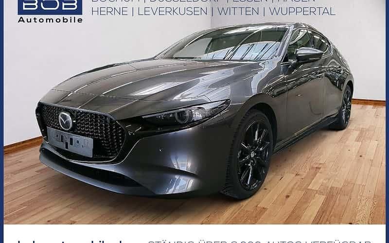 Grau Gebraucht 2024 Mazda 3 Exclusive Limousine | 27.410 € (Fairer Preis) - Bild 1/4