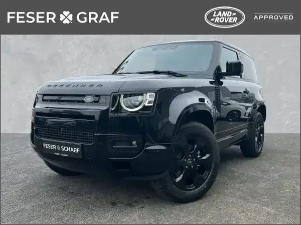 Santorini black (schwarz) Gebraucht 2024 Land Rover Defender SE Dynamic SUV | 76.850 € (Fairer Preis) - Bild 1/4