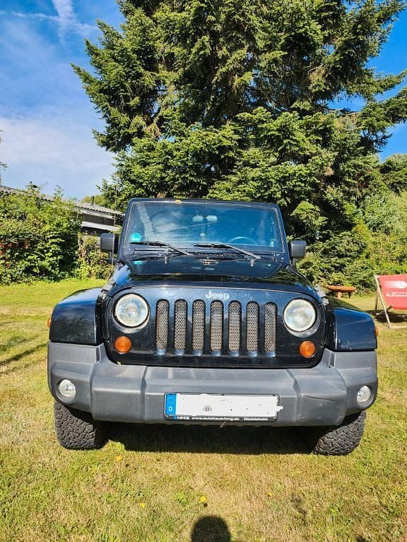 Schwarz Gebraucht 2012 Jeep Wrangler Sahara SUV | 17.900 € (Superpreis) - Bild 1/4