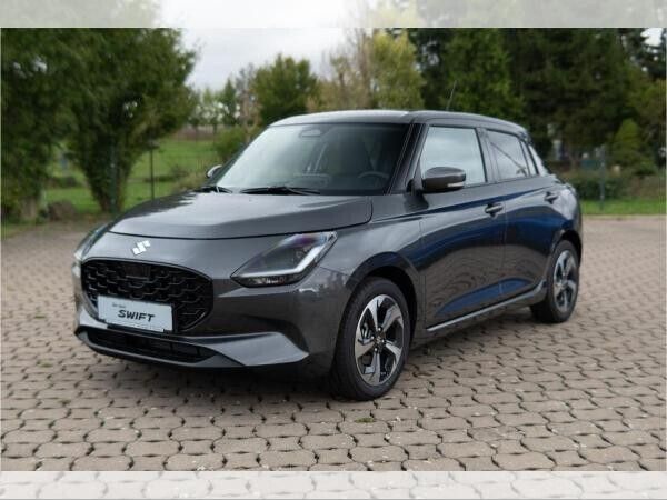Grau (mineral gray metallic) Neu 2024 Suzuki Swift Comfort+ Kleinwagen | 16.490 € - Bild 1/4