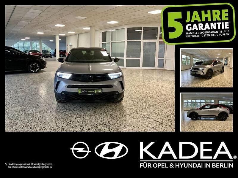 Gebraucht Opel Mokka GS Line 101 PS (74 kW) 2023 Kontrast grau/quarz silber (metallic) SUV