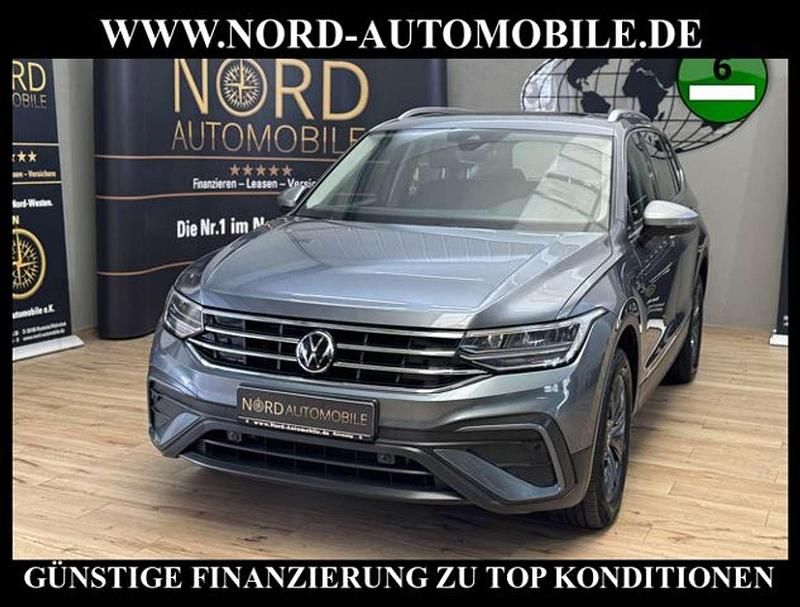 Platinum grey metallic (metallic) Gebraucht 2022 VW Tiguan Allspace Life SUV | 29.989 € (Superpreis) - Bild 1/3