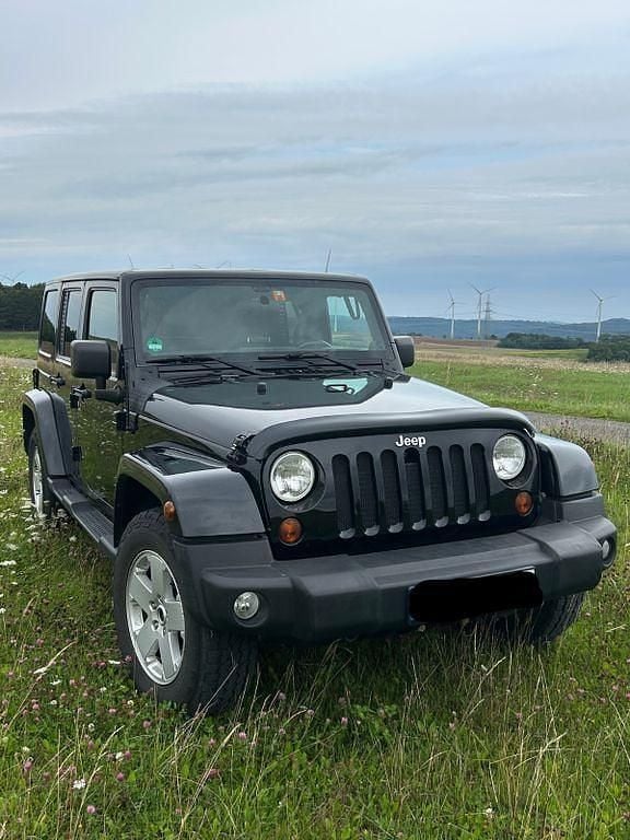 Schwarz Gebraucht 2013 Jeep Wrangler Sahara SUV | 28.200 € (Fairer Preis) - Bild 1/4