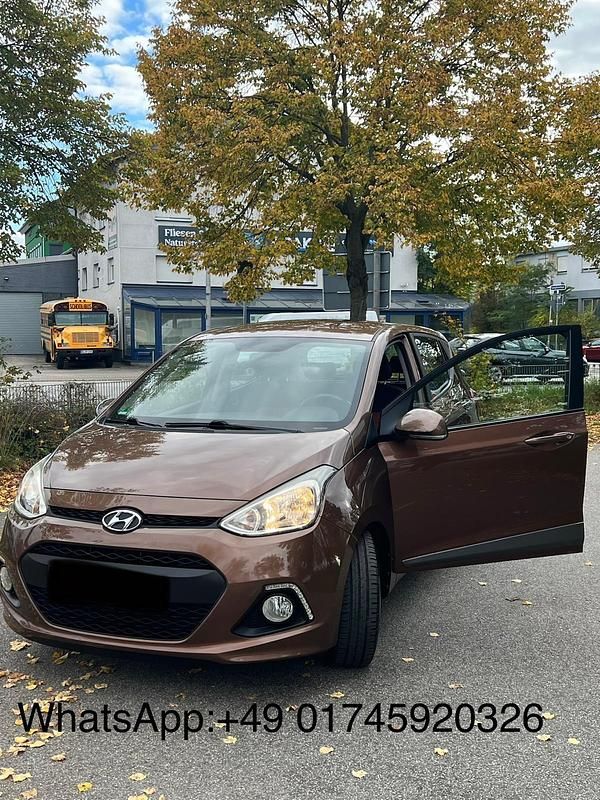 Braun Gebraucht 2015 Hyundai i10 Kleinwagen | 7.590 € (Fairer Preis) - Bild 1/4