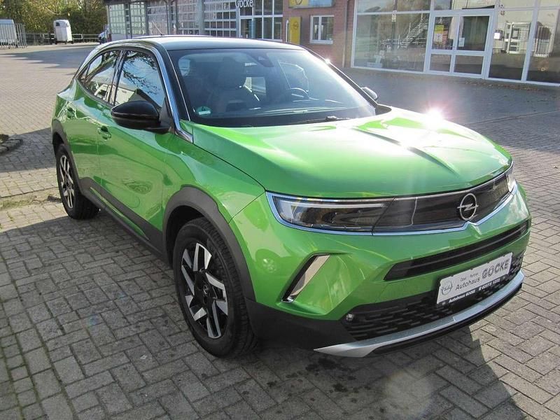 Gebraucht Opel Mokka Elegance 131 PS (96 kW) 2021 Matcha green/ikone gruen SUV
