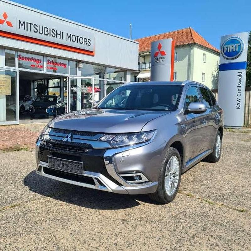 Platinumgrau Gebraucht 2019 Mitsubishi Outlander P-HEV Intro Edition SUV | 22.250 € (Fairer Preis) - Bild 1/4