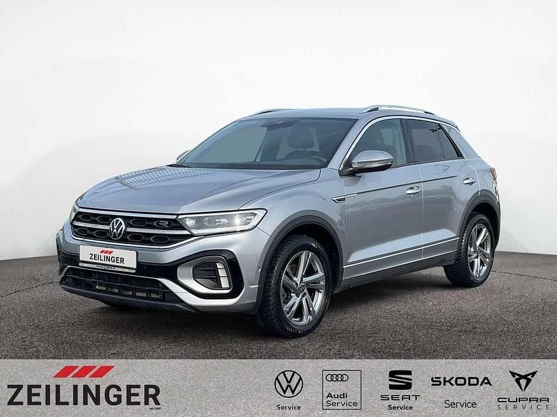 Pyrit silber Gebraucht 2024 VW T-Roc R-line SUV | 26.444 € (Superpreis) - Bild 1/4