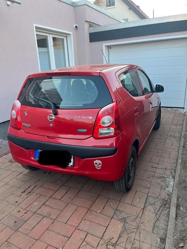 Gebraucht Nissan Pixo 68 PS (50 kW) 2009 Rot Kleinwagen