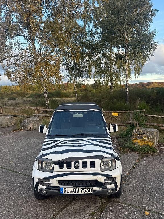 Schwarz Gebraucht 2007 Suzuki Jimny SUV | 6.490 € (Fairer Preis) - Bild 1/4
