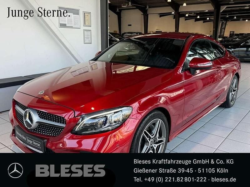 Designo hyazinthrot Gebraucht 2021 Mercedes C180 AMG Coupé | 33.900 € (Fairer Preis) - Bild 1/4
