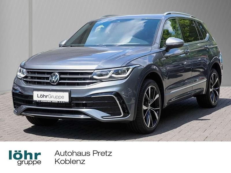 Platinum grey metallic Gebraucht 2024 VW Tiguan Allspace R-line SUV | 47.480 € (Teuer) - Bild 1/4