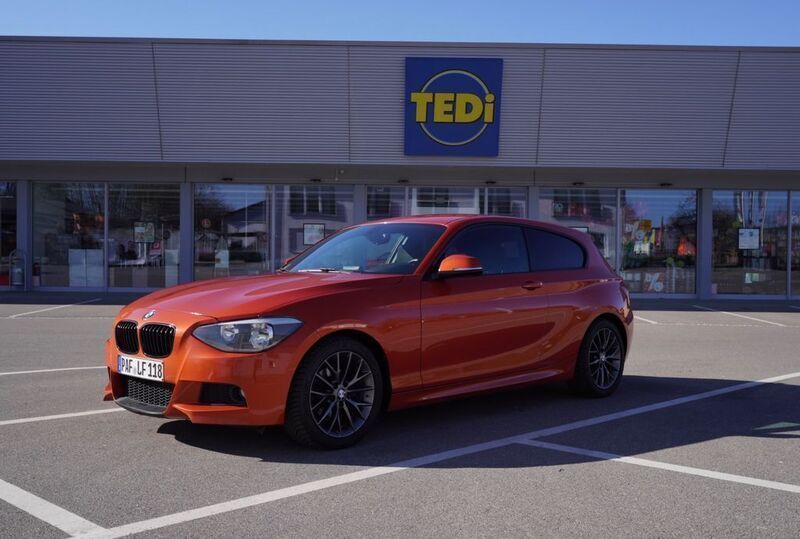 Orange Gebraucht 2012 BMW 118 Sport Line Kleinwagen | 9.500 € - Bild 1/4