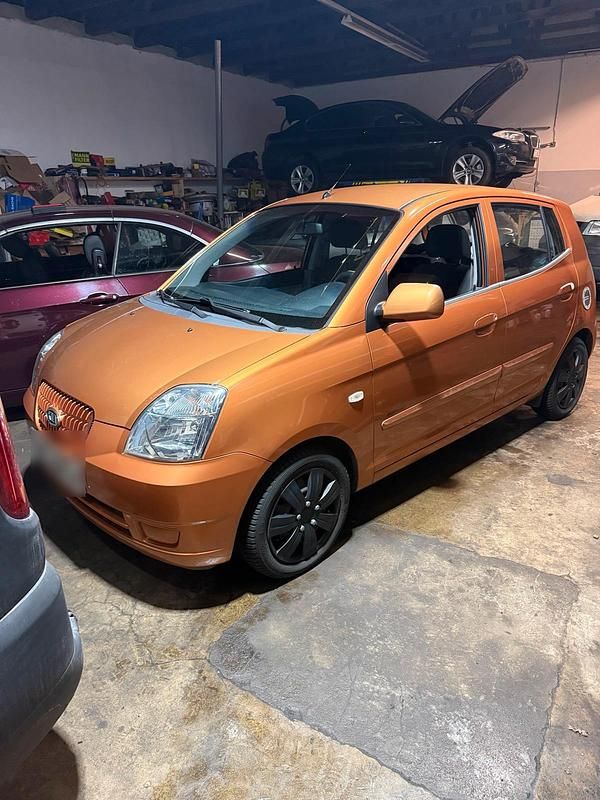 Second-hand Kia Picanto 65 CP (47 kW) 2006 Portocaliu Hatchback
