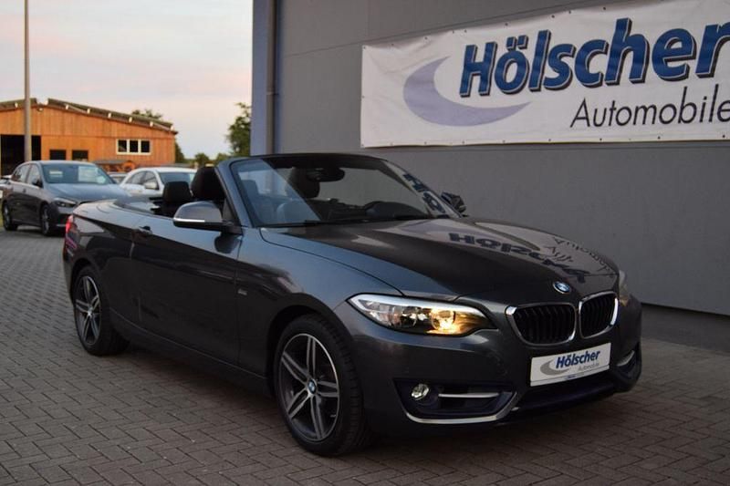 Mineralgrau Gebraucht 2016 BMW 218 Sport Line Cabrio | 17.990 € (Fairer Preis) - Bild 1/4