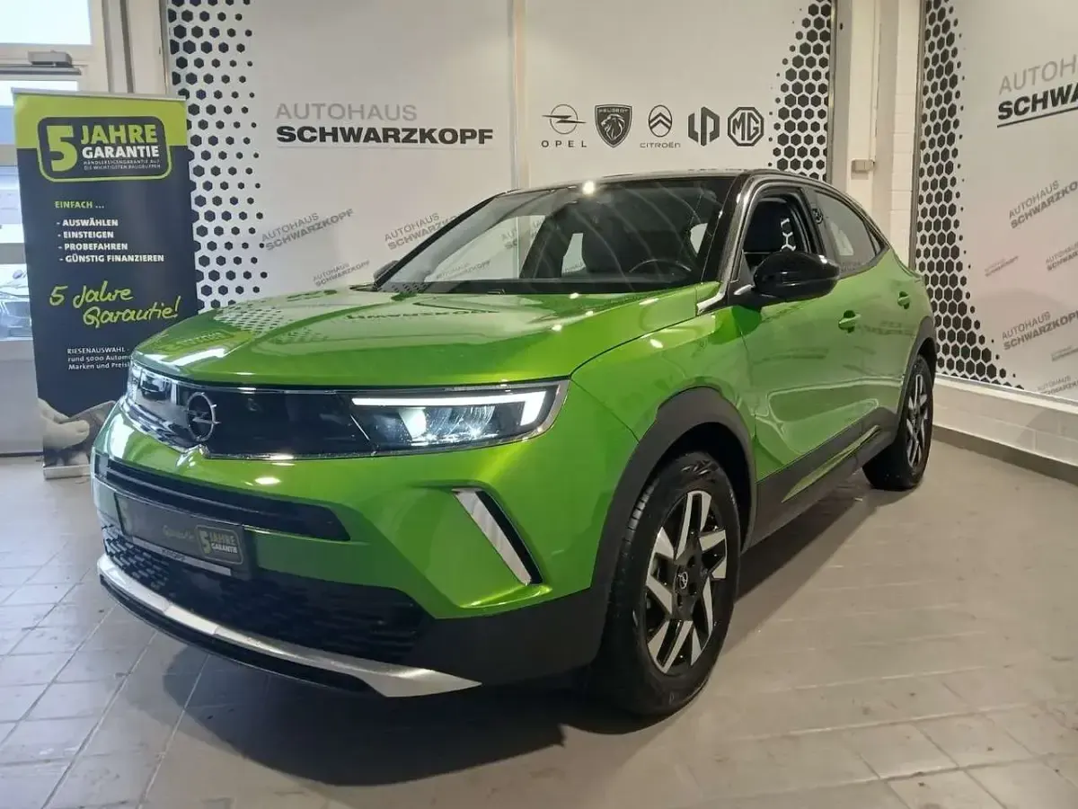 Gebraucht Opel Mokka-e Elegance 100 kW (136 PS) 2023 Matcha green/ikone gruen SUV