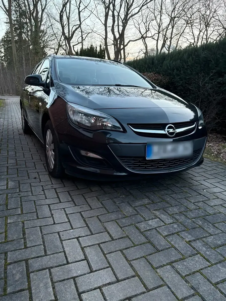 Używany Opel Astra 110 KM (80 kW) 2015 Czarny Kombi