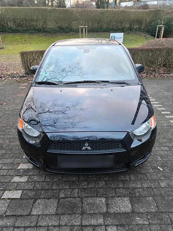 Gebraucht Mitsubishi Colt 75 PS (55 kW) 2010 Schwarz Kleinwagen