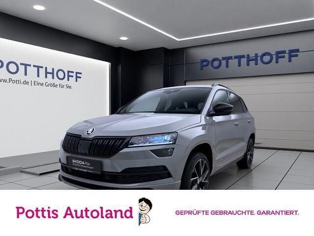 Grau Gebraucht 2021 Skoda Karoq SportLine SUV | 28.777 € (Fairer Preis) - Bild 1/4