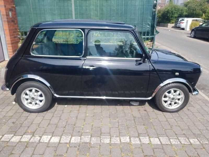 Second-hand Mini 1000 41 CP (30 kW) 1991 Negru Hatchback