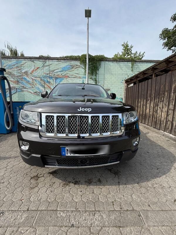 Braun Gebraucht 2012 Jeep Grand Cherokee Overland SUV | 8.999 € - Bild 1/4